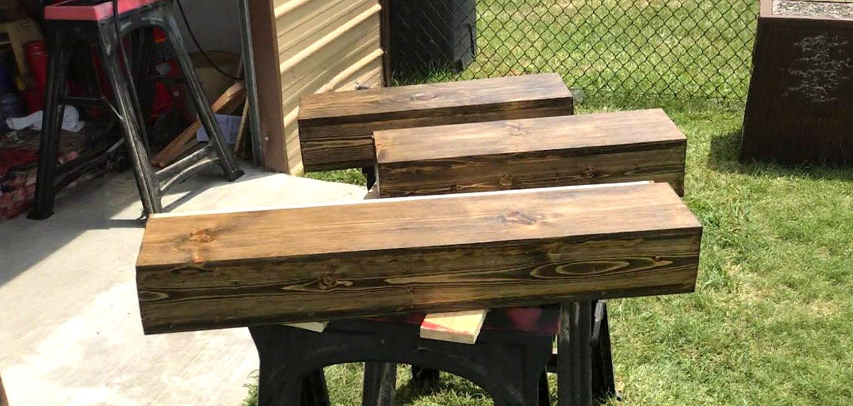 Three stained wooden storage boxes finished in the shop