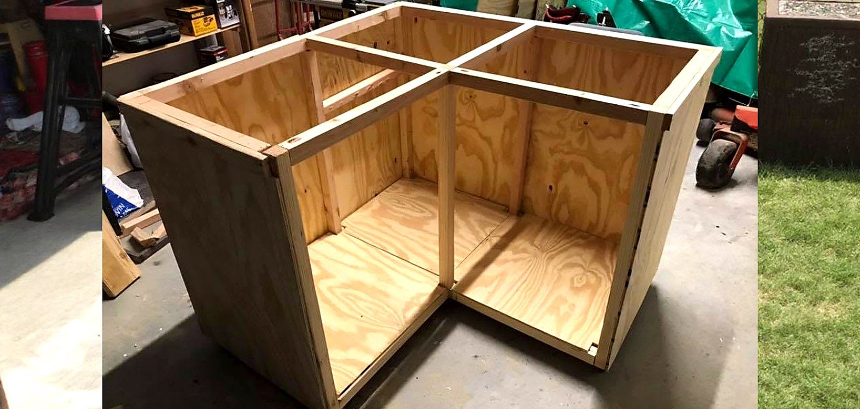 A plywood corner cabinet carcass being assembled in the shop